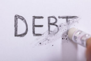 Pencil Eraser Erasing the word debt