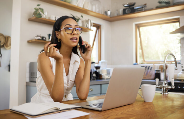 Woman on phone learning what it might cost to sell her structured settlement