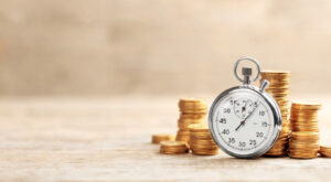 Clock with gold coins surrounding it