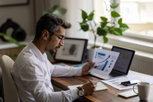 Man at desk looking into annuity buying options